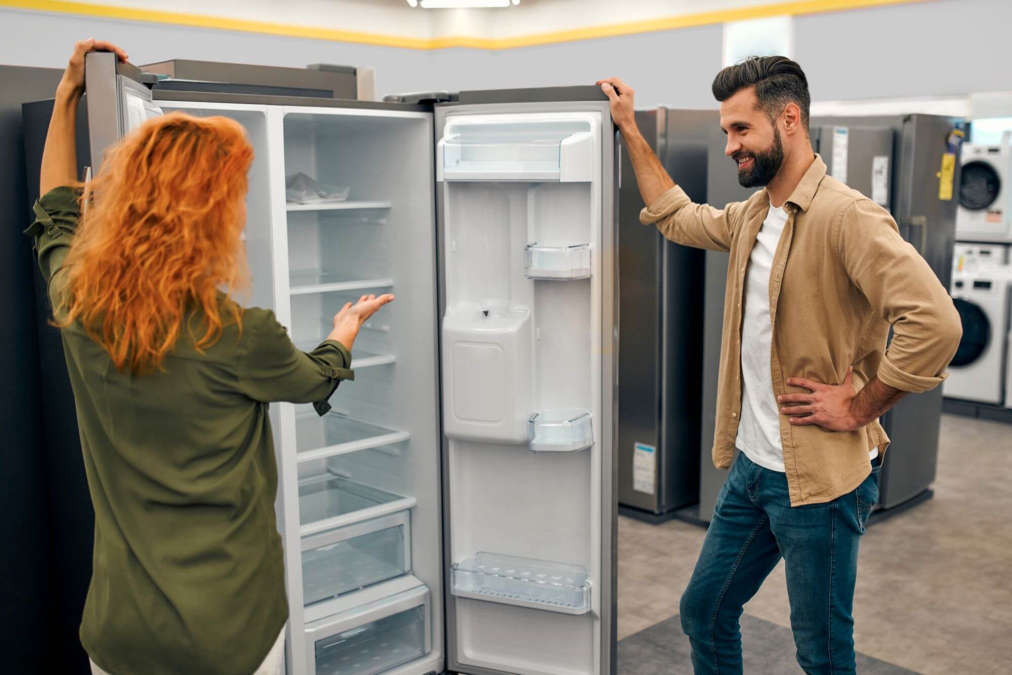 an image displaying the homeowner looking to buy a new appliance in the showroom