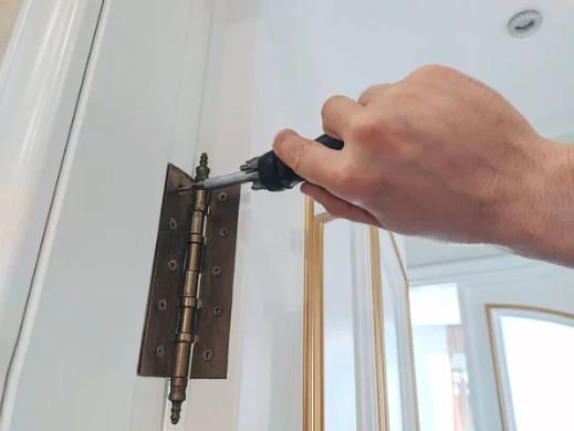an image of a person trying to fix a squeaky door